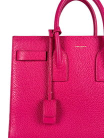 Close-up of Saint Laurent Paris stamp and grained leather