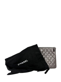 Chanel Medium O-Case in quilted camellia-embossed leather
