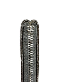 Chanel Medium O-Case in quilted camellia-embossed leather