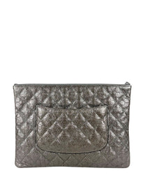 Chanel Medium O-Case in quilted camellia-embossed leather