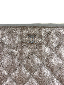 Chanel Medium O-Case in quilted camellia-embossed leather