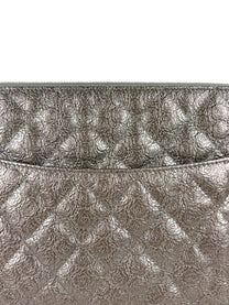 Chanel Medium O-Case in quilted camellia-embossed leather